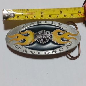 Harley Davidson belt buckle with flames black and silver .